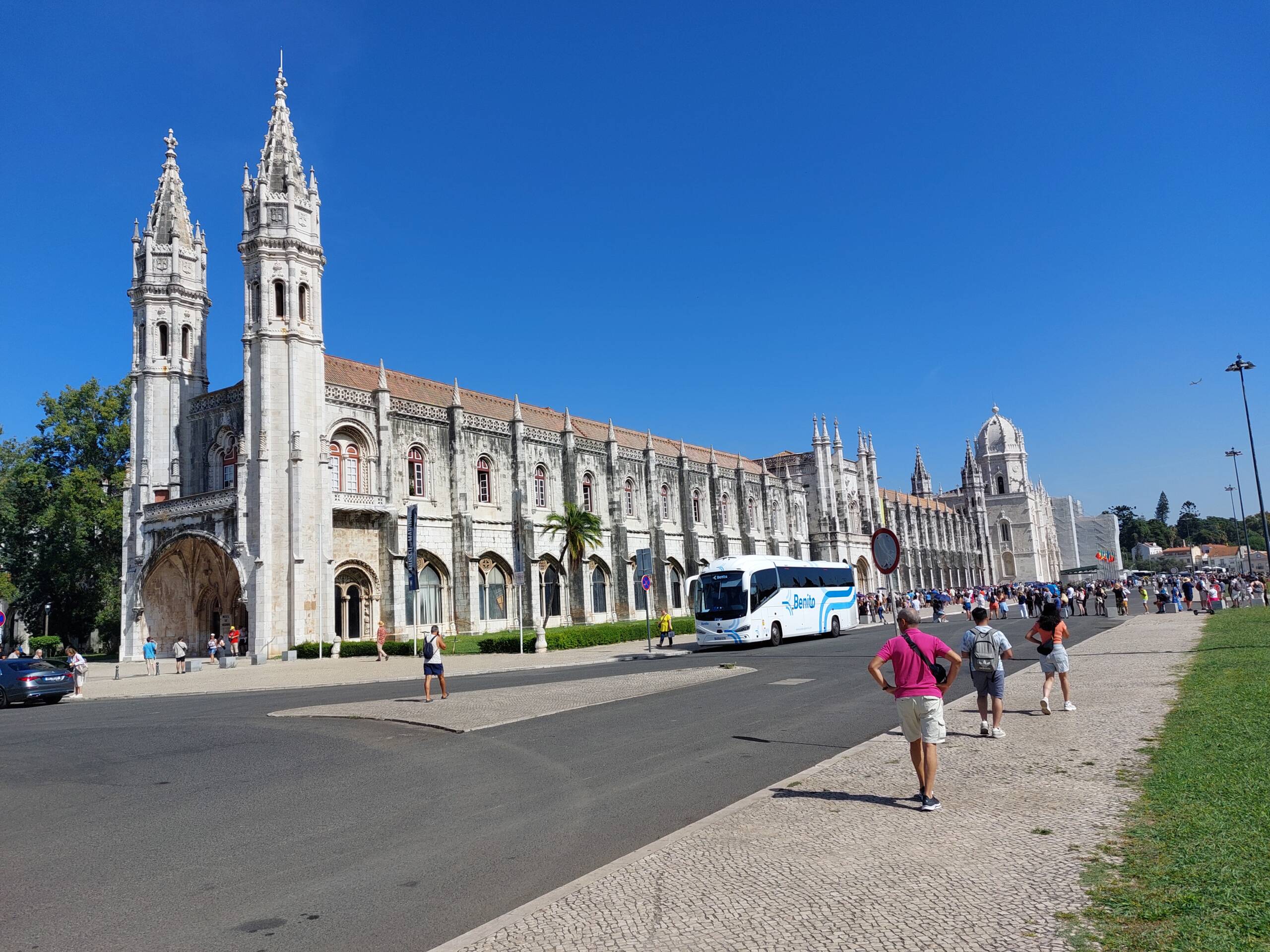 The Mosteiro dos Jerónimos facade in Belém, Lisbon, under a deep blue October sky