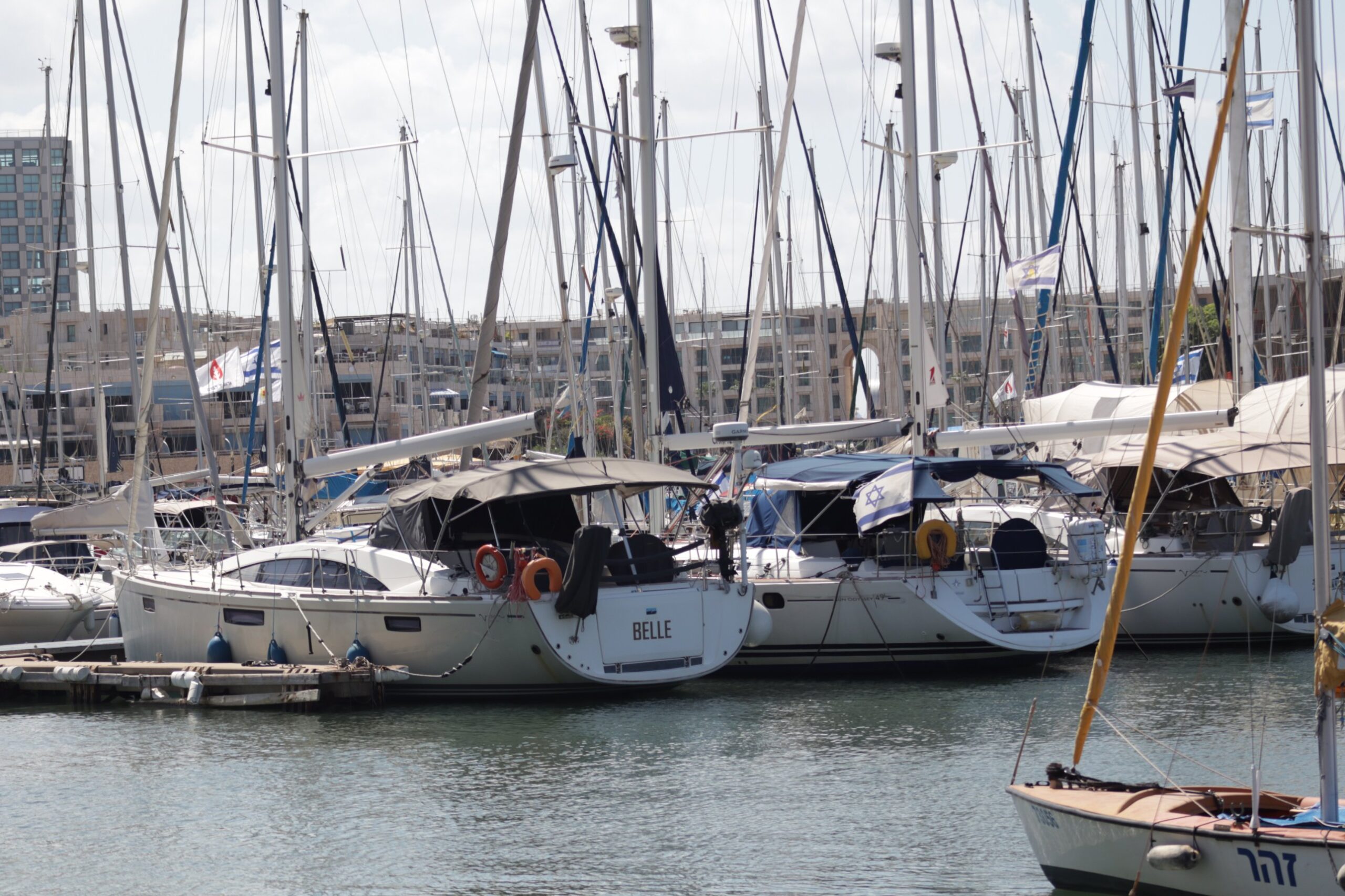 Sailing yachts with Israeli flags moored at Herzliya Marina